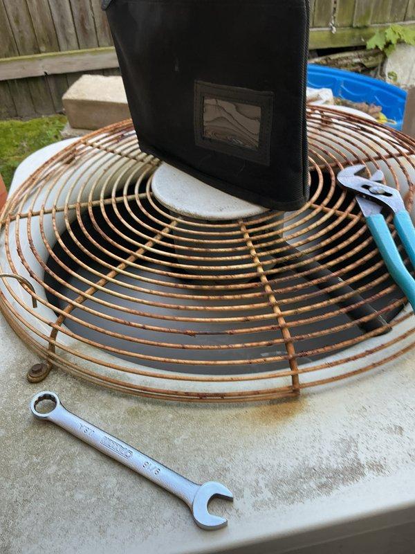 Completed annual cooling maintenance on outdoor heat pump unit. Connected manifold gauge set to measure system pressures and verify refrigerant charge levels. Removed and replaced air filter. Inspected condenser coil and fan guard, noting significant weathering and rust accumulation on exterior components from prolonged outdoor exposure. System operational at time of departure.