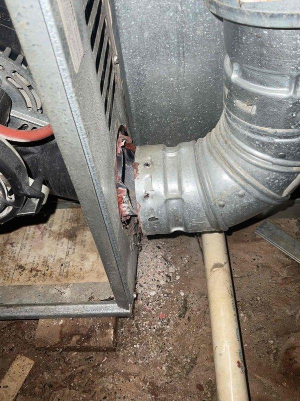 Provided comprehensive estimate for complete air conditioning system replacement in attic location accessible by built-in ladder. Existing non-functional unit exhibited significant age-related deterioration, including visible rust on metal components, corroded ductwork connections, and accumulated debris throughout the mechanical space. Assessment documented compromised equipment housing, dusty flexible ductwork with surface deterioration, and outdated air handler requiring full system upgrade to restore cooling capacity and ensure reliable operation.