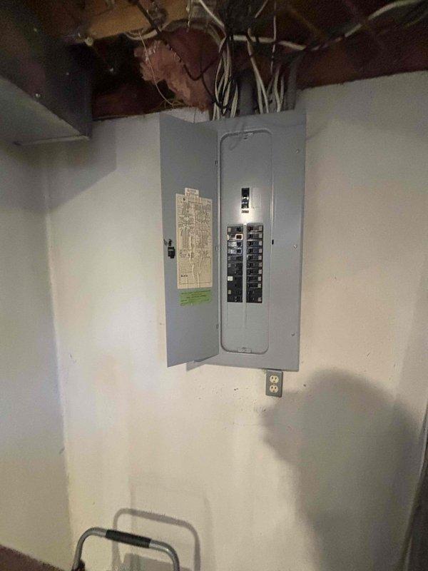 Conducted comprehensive assessment of 30-year-old HVAC system located in basement for equipment replacement estimate. Evaluated existing natural gas furnace, air conditioning unit, air handler, and associated ductwork connections. Documented current system configuration including electrical service panel capacity, equipment placement, and existing infrastructure to develop replacement recommendations for aging climate control system.