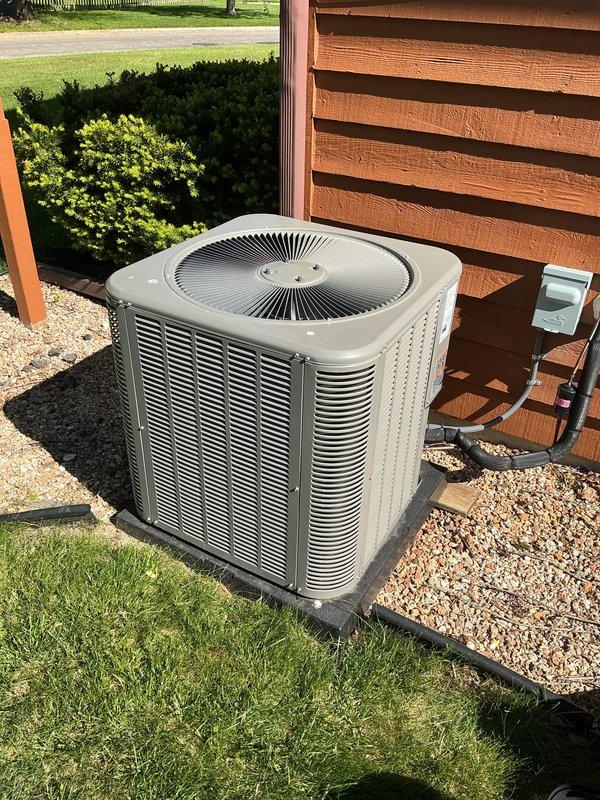 Completed scheduled air conditioning maintenance on Lennox ML13KC1-030-230A01 condenser unit manufactured in March 2025, utilizing R-454B refrigerant with factory charge of 4 lbs 14 oz. Unit was inspected, found to be operating properly with clean coil fins, proper clearances maintained, and all electrical connections secure at the outdoor disconnect. System documentation photographed for service records.
