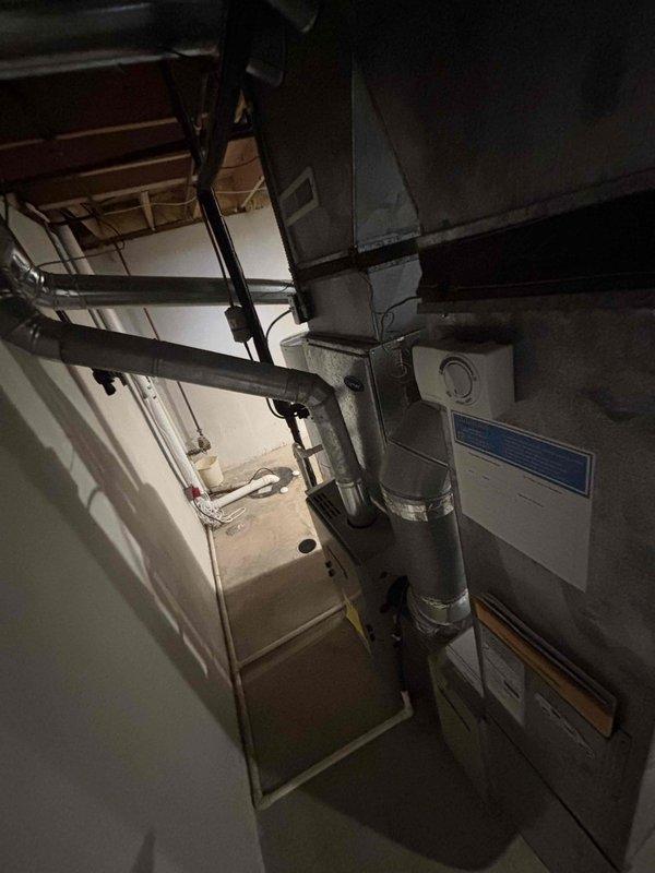 Responded to service call for 10-year-old forced air furnace that would not turn on and exhibited burnt odor. Conducted comprehensive system assessment of existing HVAC equipment in mechanical room. Evaluated aged outdoor condensing unit showing significant weathering and lack of maintenance. Based on system failure, safety concerns from burnt smell, and equipment age, provided estimate for complete HVAC replacement including new furnace and air conditioning system per promotional offer.