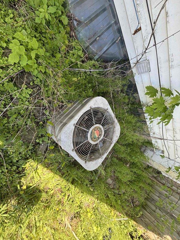 Responded to service call for 10-year-old forced air furnace that would not turn on and exhibited burnt odor. Conducted comprehensive system assessment of existing HVAC equipment in mechanical room. Evaluated aged outdoor condensing unit showing significant weathering and lack of maintenance. Based on system failure, safety concerns from burnt smell, and equipment age, provided estimate for complete HVAC replacement including new furnace and air conditioning system per promotional offer.