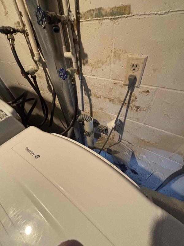 Provided estimate for furnace replacement in basement mechanical room where existing unit is non-operational and has reached end of service life. Assessed confined space installation with existing ductwork, evaluated electrical and gas connections, and documented current equipment configuration including adjacent water heater and plumbing systems to determine proper replacement specifications and clearance requirements.