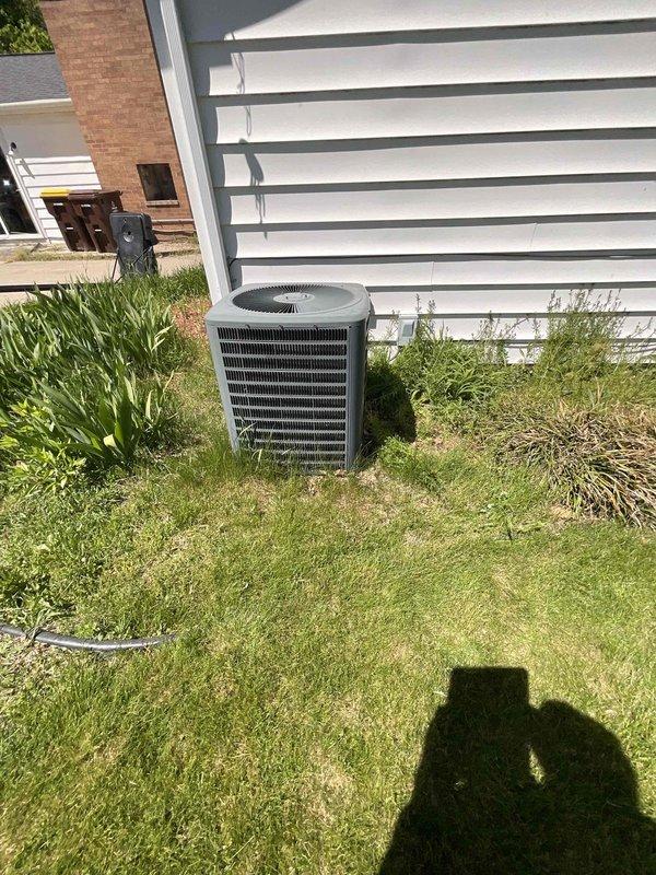 Conducted comprehensive assessment for replacement of 22-year-old HVAC system with non-functional air conditioning unit and operational natural gas furnace located in main floor utility room. Evaluated existing outdoor condenser unit showing signs of age and vegetation encroachment, documented equipment specifications, and provided detailed replacement estimate for complete furnace and air conditioning system upgrade to restore full climate control functionality.