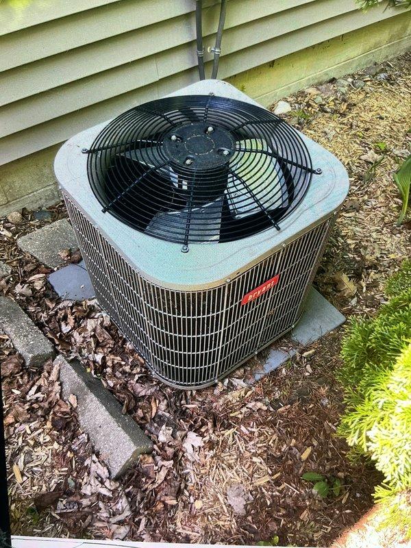Completed annual preventive maintenance service on residential central air conditioning system. Performed comprehensive inspection of outdoor condenser unit, including visual assessment of cabinet condition, fan motor operation, and electrical connections. Cleared debris and leaves from around unit base and verified proper clearances for adequate airflow. Inspected refrigerant lines, condensate drainage system, and electrical conduit for proper installation and condition. Verified fan guard integrity and checked unit mounting stability on concrete pad. System operational and cooling effectively at time of service completion.