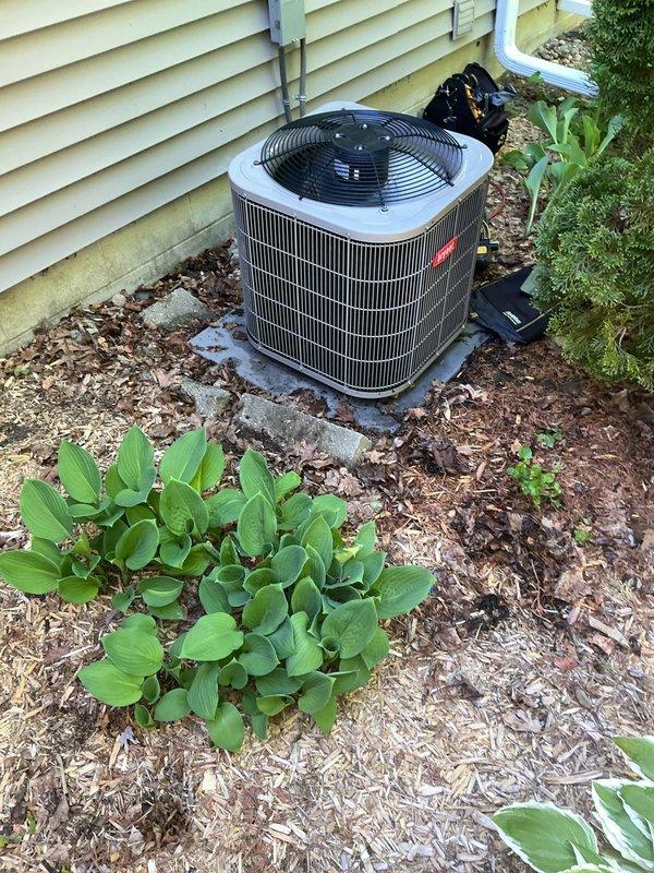 Completed annual preventive maintenance service on residential central air conditioning system. Performed comprehensive inspection of outdoor condenser unit, including visual assessment of cabinet condition, fan motor operation, and electrical connections. Cleared debris and leaves from around unit base and verified proper clearances for adequate airflow. Inspected refrigerant lines, condensate drainage system, and electrical conduit for proper installation and condition. Verified fan guard integrity and checked unit mounting stability on concrete pad. System operational and cooling effectively at time of service completion.