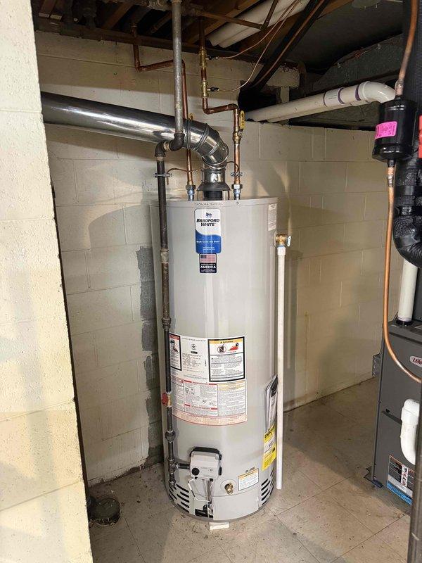 Installed 50-gallon tanked water heater in basement utility area with proper venting and plumbing connections. Investigated and addressed pipe noise issues related to previous furnace installation, ensuring all supply lines and exhaust pipes were properly secured and isolated to eliminate rubbing contact points. All connections tested and permits requested for inspection.