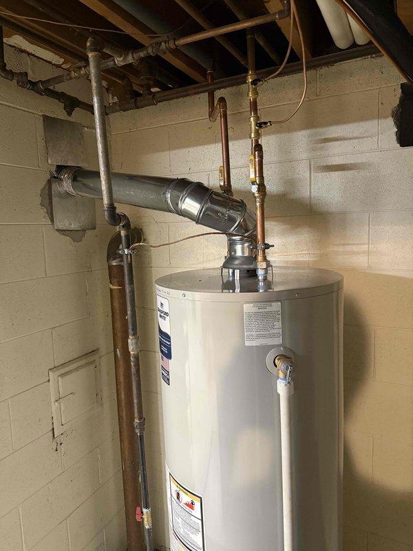 Installed 50-gallon tanked water heater in basement utility area with proper venting and plumbing connections. Investigated and addressed pipe noise issues related to previous furnace installation, ensuring all supply lines and exhaust pipes were properly secured and isolated to eliminate rubbing contact points. All connections tested and permits requested for inspection.