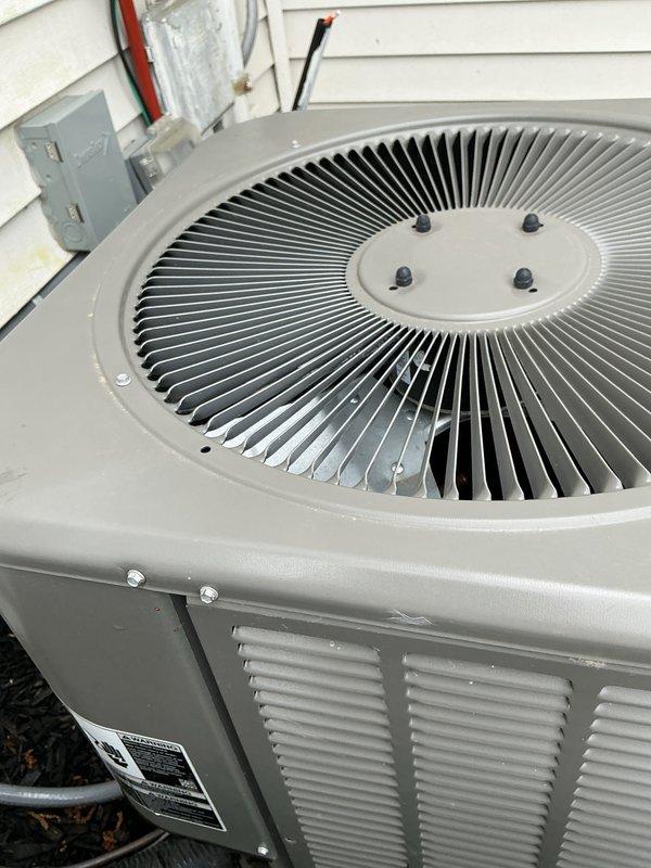 Completed annual cooling maintenance on residential air conditioning system. Inspected outdoor condenser unit, verified fan operation and blade alignment, checked electrical connections at disconnect box, and assessed overall system condition. Unit found in good working order with all components functioning properly.