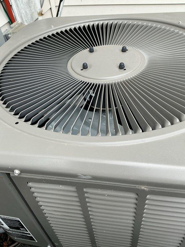 Completed annual cooling maintenance on residential air conditioning system. Inspected outdoor condenser unit, verified fan operation and blade alignment, checked electrical connections at disconnect box, and assessed overall system condition. Unit found in good working order with all components functioning properly.