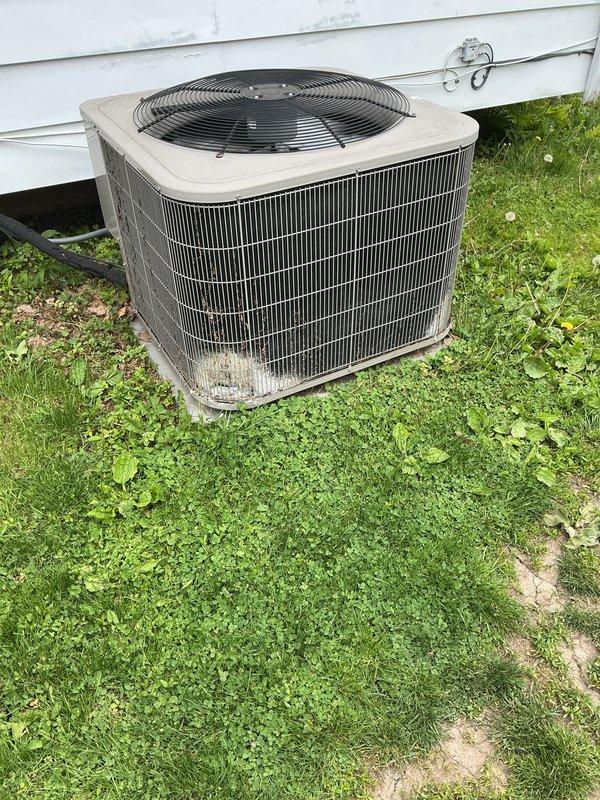 Completed comprehensive tune-up on 10-year-old residential air conditioning system. Performed full system inspection including outdoor condensing unit evaluation, thermostat functionality check, humidifier assessment, and hot water tank examination. Unit operating within normal parameters with typical wear consistent with age and outdoor exposure.