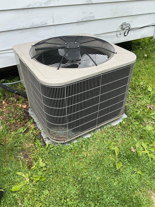 Completed comprehensive tune-up on 10-year-old residential air conditioning system. Performed full system inspection including outdoor condensing unit evaluation, thermostat functionality check, humidifier assessment, and hot water tank examination. Unit operating within normal parameters with typical wear consistent with age and outdoor exposure.
