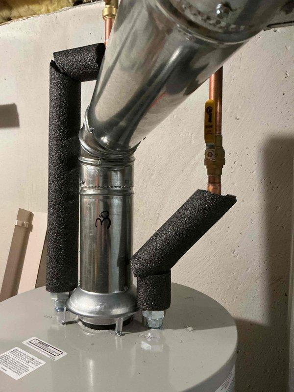 Successfully installed a 50-gallon tall skinny water heater in basement mechanical room. Completed all plumbing connections including hot and cold water lines with proper insulation, installed gas line with shut-off valve, and configured venting system with metallic vent pipe routed to existing ceiling penetration. All connections tested and verified operational with no leaks detected.
