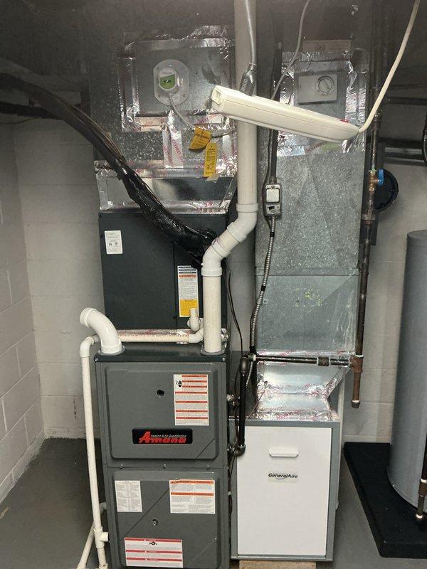 Completed annual HVAC maintenance on Amana furnace system with integrated GeneralAire humidifier. Performed comprehensive inspection of all system components including filter replacement, blower motor examination, ductwork assessment, and verification of proper drainage through PVC lines. All equipment found operating within normal parameters with no immediate service needs identified.