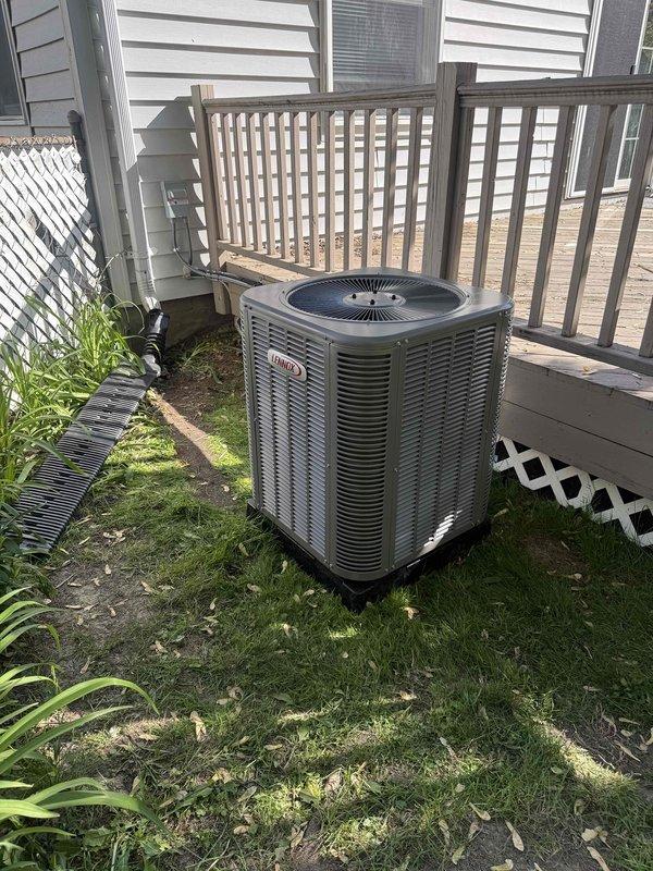 Completed installation of a 2-ton Lennox air conditioning system with matching evaporator coil. Installed outdoor condenser unit on concrete pad in rear yard location and connected new indoor coil to existing furnace system. Ran new dedicated electrical circuit to support the AC system and completed all required mechanical and electrical permit work for the installation.