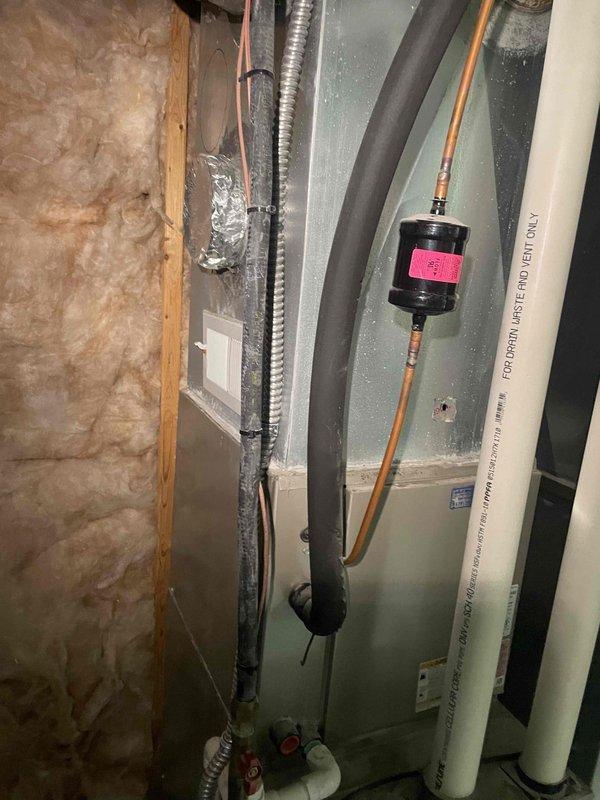 Completed on-site evaluation for air conditioning system replacement. Unit is over 10 years old and requires immediate replacement. Documented existing HVAC equipment location in mechanical room, including air handler unit, ductwork configuration, copper refrigerant lines, condensate drainage system, and flexible duct connections in attic space to facilitate accurate equipment sizing and installation planning for the replacement system.