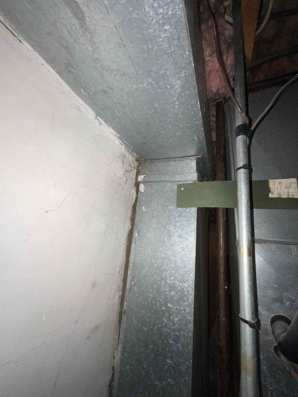 Provided comprehensive estimate for natural gas furnace replacement and ductwork modification in basement location due to cracked heat exchanger in existing unit. Assessment included evaluation of inadequate airflow to lower level and inspection of current duct distribution system with reflective insulation and aging mechanical components. Recommended complete furnace replacement with enhanced ductwork design to resolve airflow deficiencies throughout multi-level residence.