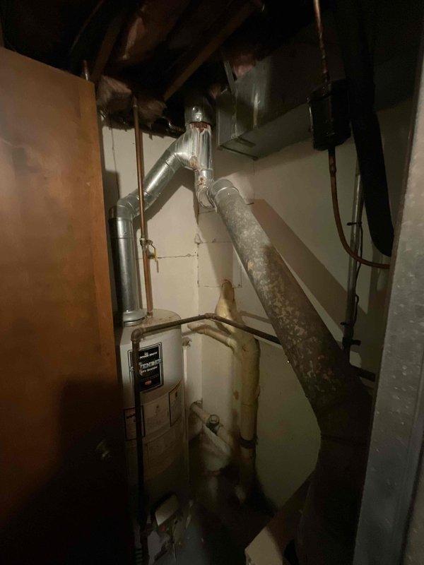 Provided comprehensive estimate for natural gas furnace replacement and ductwork modification in basement location due to cracked heat exchanger in existing unit. Assessment included evaluation of inadequate airflow to lower level and inspection of current duct distribution system with reflective insulation and aging mechanical components. Recommended complete furnace replacement with enhanced ductwork design to resolve airflow deficiencies throughout multi-level residence.