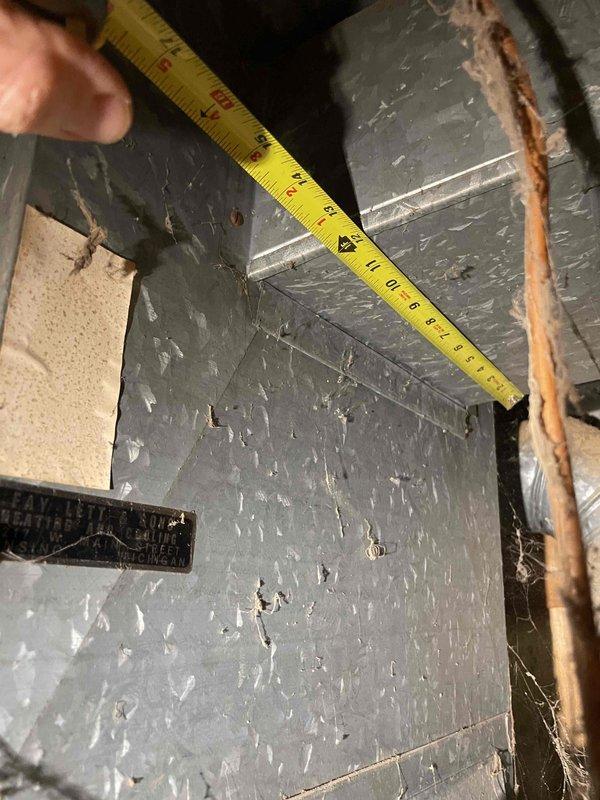Conducted comprehensive site evaluation for full HVAC system replacement at residential property. Existing equipment consists of a 16-year-old furnace and 4-year-old air conditioning unit, with customer requesting replacement of aging furnace and installation of new AC system. Performed detailed assessment of attic-installed equipment, documenting existing ductwork dimensions and clearances using precision measurements. Evaluated structural accessibility, existing copper refrigerant line conditions, and duct system configuration to determine optimal replacement specifications. Photographed current installation conditions including ductwork layout, insulation placement, and spatial constraints within attic cavity. Assessment revealed adequate access for equipment removal and new system installation. Provided customer with complete system replacement quote addressing both heating and cooling components to meet requested timeline for replacement within current season.