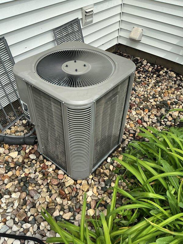 Completed ComfortGuard Maintenance Package on residential HVAC system. Performed comprehensive inspection of outdoor condenser unit, replaced air filters and humidifier pads as requested, and verified proper system operation. Unit showed normal weathering for outdoor installation with adequate clearance and drainage around equipment.