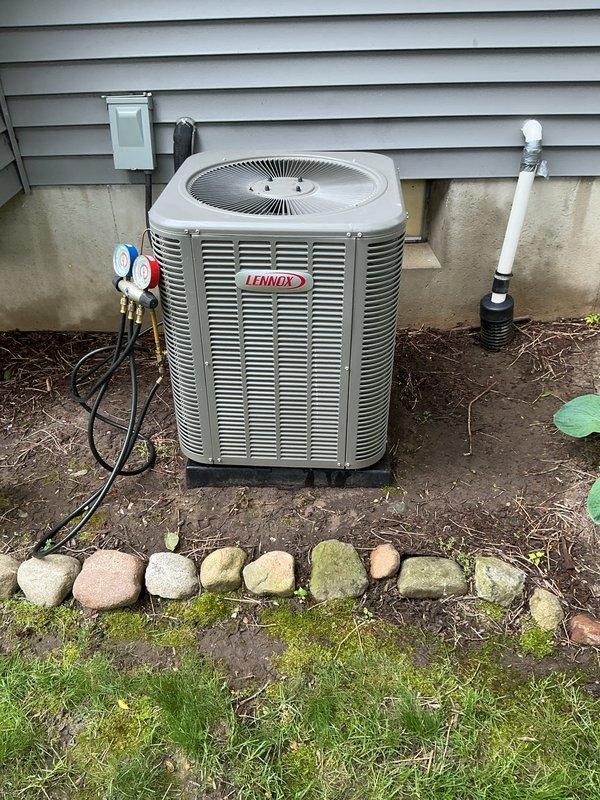Completed annual cooling maintenance on Lennox heat pump system. Performed comprehensive inspection of outdoor unit, checked refrigerant pressures using manifold gauges, verified electrical connections at disconnect box, inspected condensate drain line operation, and confirmed proper system operation with no deficiencies noted.