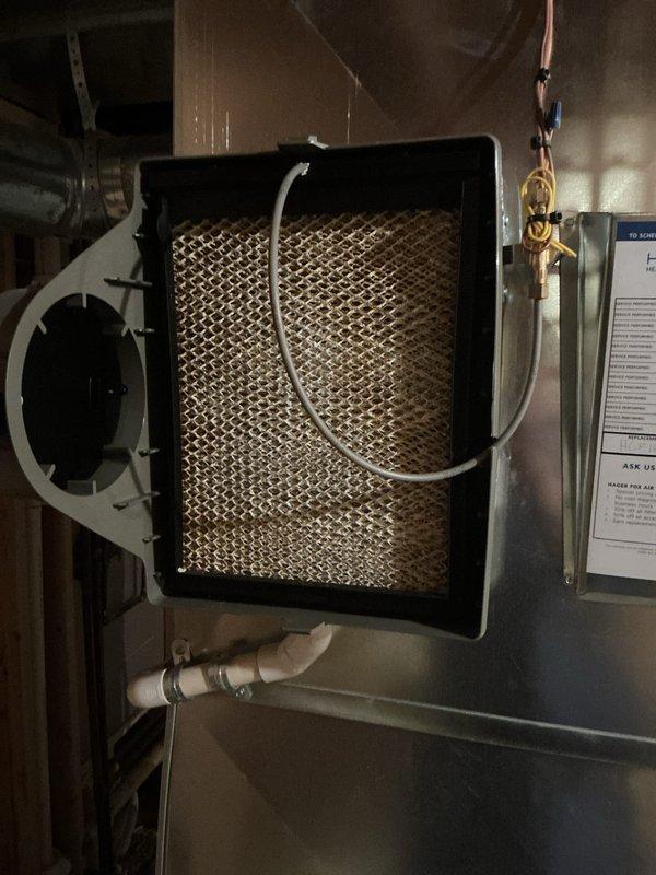 Completed annual cooling maintenance on residential HVAC system. Inspected Lennox furnace unit, air handler components, and associated ductwork in basement mechanical room. Examined evaporator coil assembly with mesh filter, verified proper refrigerant line connections, checked condensate drainage system including PVC piping and sump pump operation, and confirmed all electrical connections and controls were functioning properly. System operating within normal parameters with no deficiencies noted.
