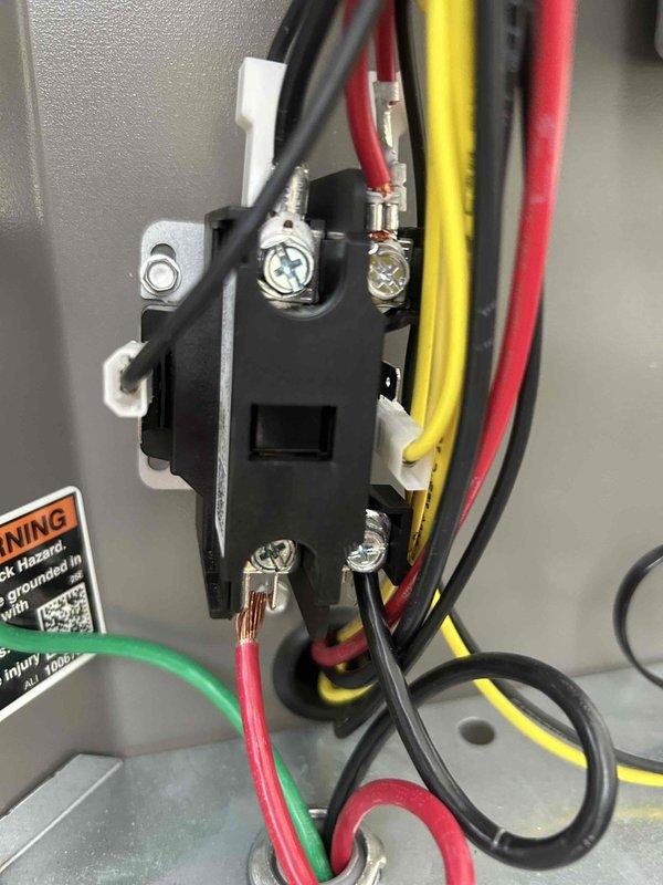Performed diagnostic service on outdoor A/C condenser unit located on exterior concrete pad. Inspected electrical contactor/relay component and verified proper wire connections including power supply and ground wiring. Unit is approximately 2 years old with both parts and labor warranty coverage in effect. System inspected and operational at time of service completion.