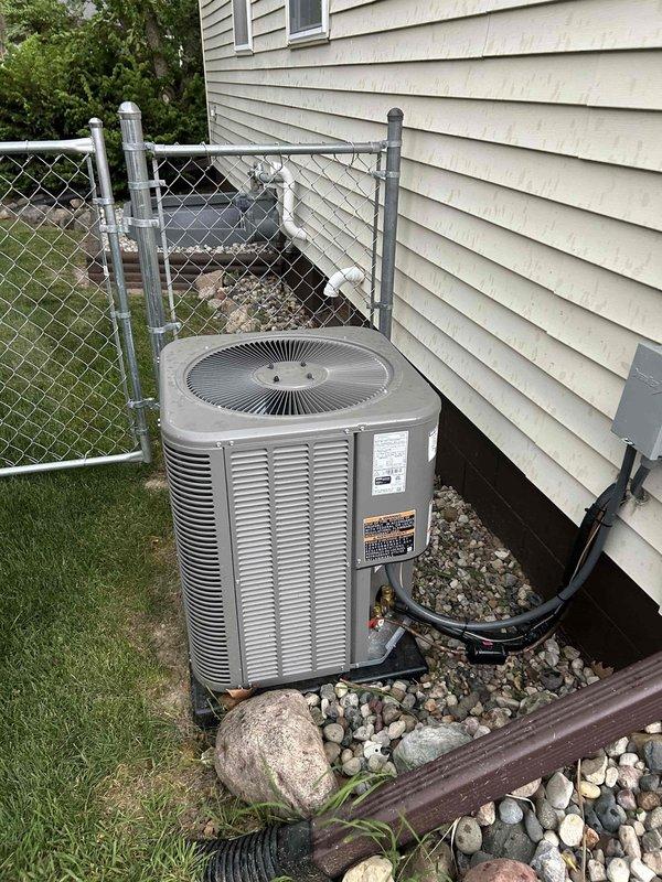 Performed diagnostic service on outdoor A/C condenser unit located on exterior concrete pad. Inspected electrical contactor/relay component and verified proper wire connections including power supply and ground wiring. Unit is approximately 2 years old with both parts and labor warranty coverage in effect. System inspected and operational at time of service completion.
