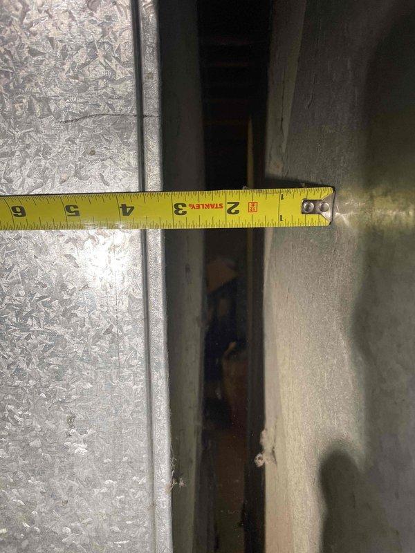 Conducted on-site estimate for central air conditioning installation at single-family ranch home with existing forced-air heating system and ductwork infrastructure. Performed detailed assessment of existing duct system, measuring trunk line dimensions and evaluating current ductwork condition to determine compatibility with proposed AC system. Documented duct sizing and configuration, noting existing metal ductwork appears adequate for AC integration, and provided customer with equipment options and installation specifications for complete central cooling system addition.