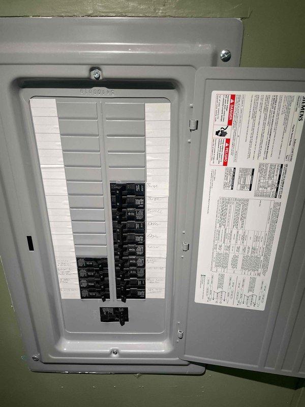 Conducted site assessment for new central air conditioning system installation in mobile home with no existing central AC. Evaluated electrical panel capacity and verified adequate breaker space and amperage availability for new AC unit installation. Inspected existing HVAC closet space with louvered access panel to confirm adequate clearance and ventilation for indoor air handler placement. Documented existing electrical infrastructure and mechanical space configuration to prepare estimate for complete split-system air conditioning installation including outdoor condensing unit, indoor air handler, refrigerant lines, condensate drain, thermostat, and electrical connections.