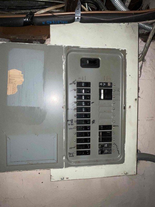 Completed air conditioner replacement estimate for residential property with existing AC unit still operational but aged approximately 15-20 years. Assessed outdoor condenser unit condition, reviewed electrical service panel capacity for replacement system compatibility, and documented existing installation configuration. Provided replacement system options and recommendations based on current equipment age and home's existing infrastructure, noting furnace had been previously replaced.