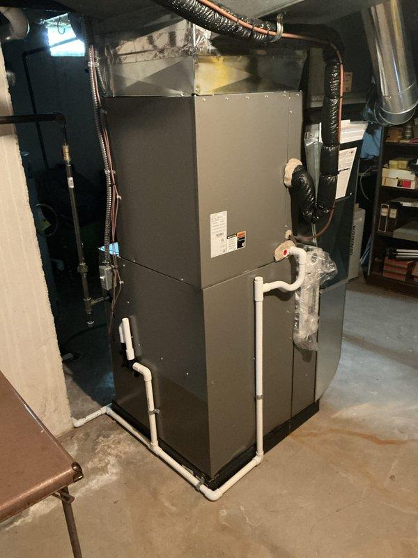 Completed annual cooling maintenance on residential HVAC system. Inspected air handler unit and evaporator coil assembly, confirmed filter was clean and properly secured within frame. Noted spots on filter and pad as indicated in service notes. Verified all refrigerant lines, copper piping, and blower assembly components were in good working condition with no visible damage or excessive dirt accumulation. Inspected furnace unit, ductwork connections, and condensate drain lines; all components operating properly with no anomalies detected.
