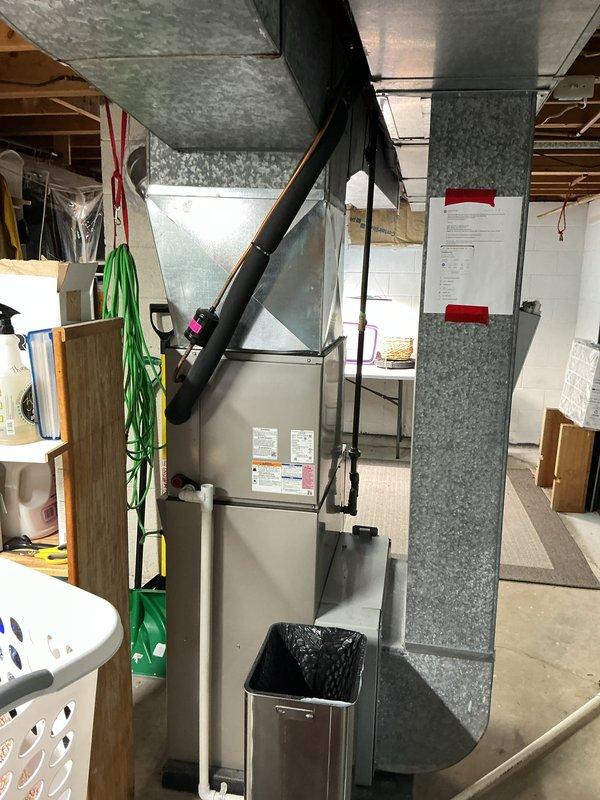Performed routine Air Care Cooling maintenance on residential HVAC system. Accessed evaporator coil assembly, inspected A-frame coil configuration and serpentine tubing for proper condition, verified drain pan and condensate line functionality, and documented system components with photographic records. All equipment operating within normal parameters with no deficiencies noted.