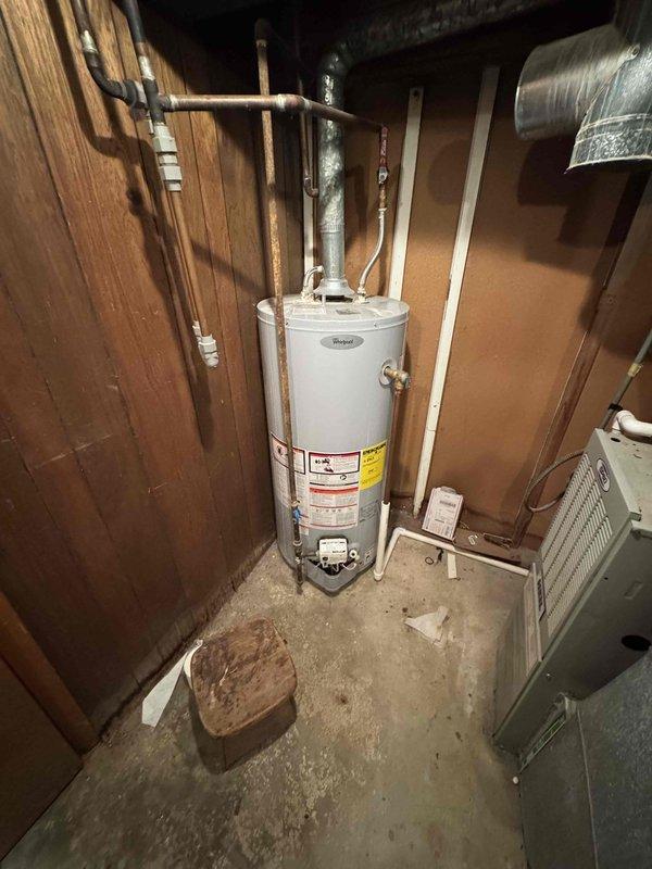 Responded to service call for central air conditioning system not cooling adequately. Upon arrival, performed diagnostic assessment of AC unit and measured supply air temperature at register using infrared thermometer, which confirmed insufficient cooling with probe reading of 11°F temperature differential. Inspected condensing unit, evaporator coil, and associated ductwork in basement utility area. System maintained heating capability but demonstrated reduced cooling capacity. Documented equipment conditions and temperature readings with photographic evidence for service records.