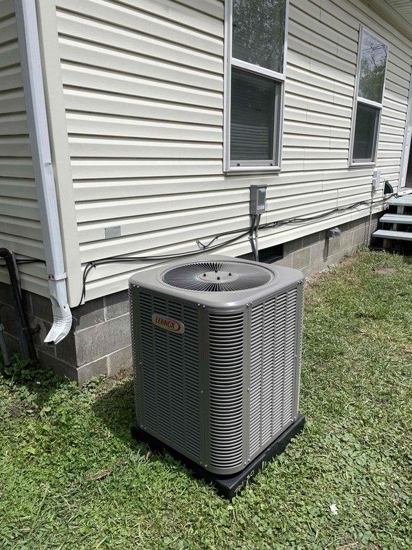 Completed full HVAC system installation including a Revolv 70,000 BTU vertical furnace installed in interior alcove and Lennox 2-ton air conditioning condensing unit positioned on exterior pad on left side of residence. Obtained mechanical and electrical permits prior to installation, ran refrigerant lines and electrical connections between indoor and outdoor units, installed condensate drain line with exterior PVC discharge, and mounted electrical disconnect box at outdoor unit. All equipment tested, commissioned, and left in operational condition with proper airflow verified at both indoor and outdoor units.