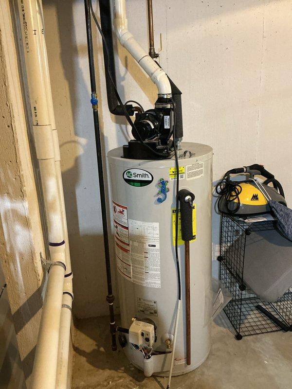 Completed routine Air Care Cooling maintenance visit, performing system inspection and filter evaluation. Inspected HVAC equipment in basement utility area, checked air filter condition within the air handler unit, and documented system components including ductwork connections and electrical wiring for quality assurance records.