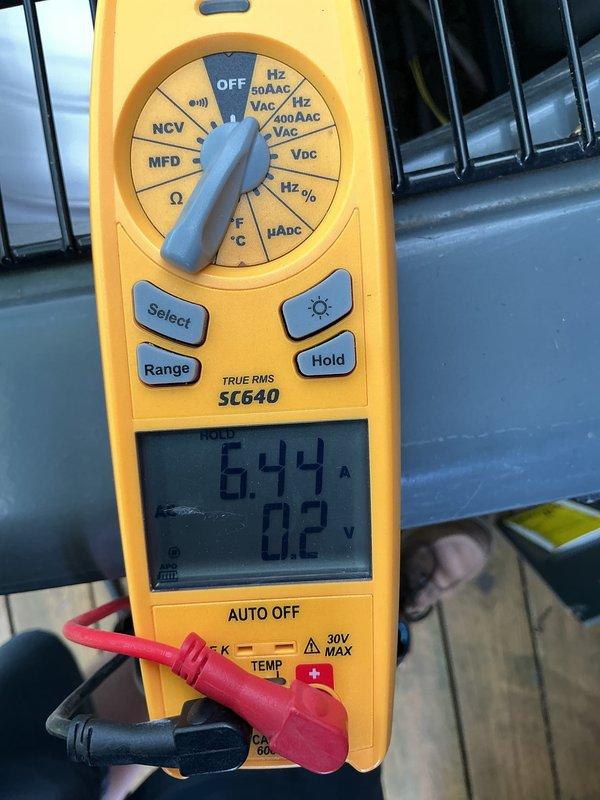 Performed annual air conditioning maintenance inspection per customer's request due to reported cooling issues. Conducted electrical diagnostics using digital multimeter, measuring amp draw at 6.99A and verifying voltage readings. Checked system temperatures, recording supply air temperature at 49.18°F, and inspected ductwork components for proper operation and airflow.