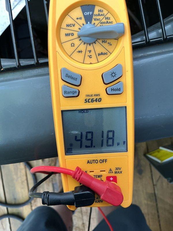 Performed annual air conditioning maintenance inspection per customer's request due to reported cooling issues. Conducted electrical diagnostics using digital multimeter, measuring amp draw at 6.99A and verifying voltage readings. Checked system temperatures, recording supply air temperature at 49.18°F, and inspected ductwork components for proper operation and airflow.