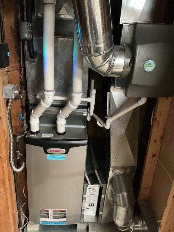Completed annual cooling maintenance on residential HVAC system. Performed comprehensive inspection of Lennox furnace and air handler in basement, checking all ductwork connections, PVC venting, and electrical components. Inspected outdoor condenser unit, verified proper operation of fan motor and compressor, checked refrigerant levels, cleaned coils, and confirmed disconnect box functionality. System operating within manufacturer specifications with no issues identified.