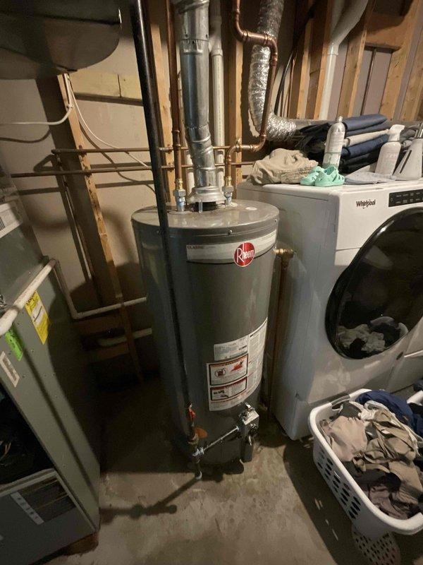 Conducted on-site evaluation for air conditioning system replacement in residential property. Assessed existing AC unit of unknown age located in basement mechanical room alongside furnace, water heater, and laundry equipment. Documented current system configuration, ductwork connections, and available access for equipment removal and installation. Evaluated electrical service, condensate drainage routing, and spatial constraints for new equipment placement. Prepared comprehensive replacement estimate for complete AC system installation to proceed at customer's earliest convenience.
