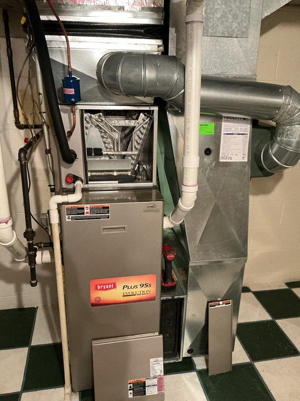 Completed routine AC maintenance on residential Bryant Plus 95s Evolution system. Performed comprehensive tune-up including inspection of furnace cabinet, heat exchanger assembly, and ductwork connections. Verified heat exchanger condition showing normal operational wear with minor mineral deposits on surfaces. Inspected serpentine coil configuration and confirmed proper assembly of tube headers and fasteners. Checked air filter screen behind heat exchanger. Examined ductwork system including rigid and flexible ducts, cylindrical plenum transitions, and proper clearances around equipment. Inspected associated plumbing connections, PVC lines, and electrical components. All systems operating within normal parameters with no issues identified or repairs required.