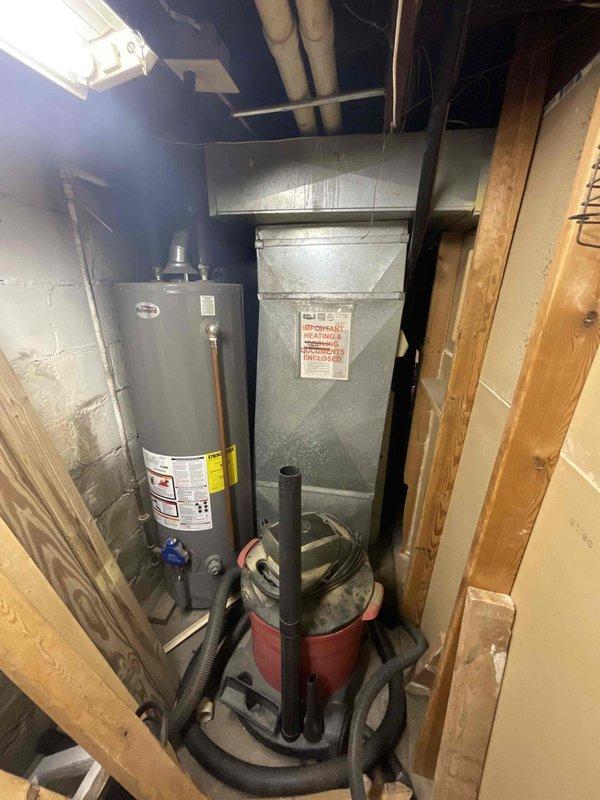 Provided estimate for complete HVAC system replacement in basement location, including natural gas furnace and air conditioning unit under promotional offer. Current 30-year-old furnace operational but air conditioning system non-functional. Assessed existing equipment configuration, ductwork connections, and installation requirements for new matched system in basement mechanical room alongside water heater.