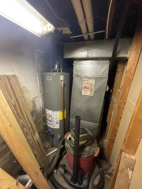 Provided estimate for complete HVAC system replacement in basement location, including natural gas furnace and air conditioning unit under promotional offer. Current 30-year-old furnace operational but air conditioning system non-functional. Assessed existing equipment configuration, ductwork connections, and installation requirements for new matched system in basement mechanical room alongside water heater.