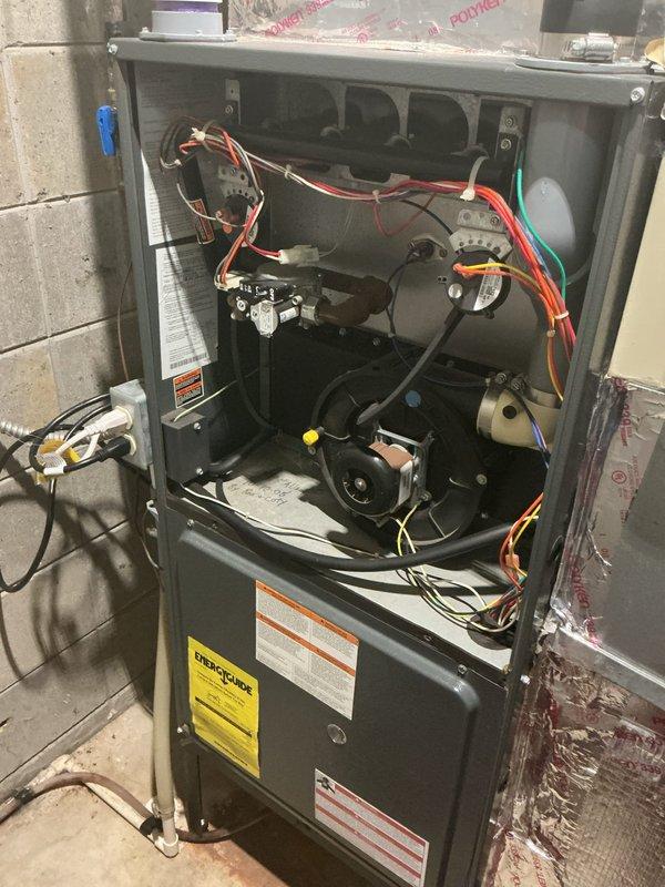 Responded to service call for air conditioning system that would not shut off, with equipment located in basement. Performed diagnostic inspection of both indoor furnace unit and outdoor condenser unit. Inspected thermostat wiring, control board connections, and contactor operation to identify cause of continuous system operation. Evaluated blower motor operation, capacitor function, and electrical connections within furnace cabinet. Examined outdoor unit for proper cycling and relay functionality.