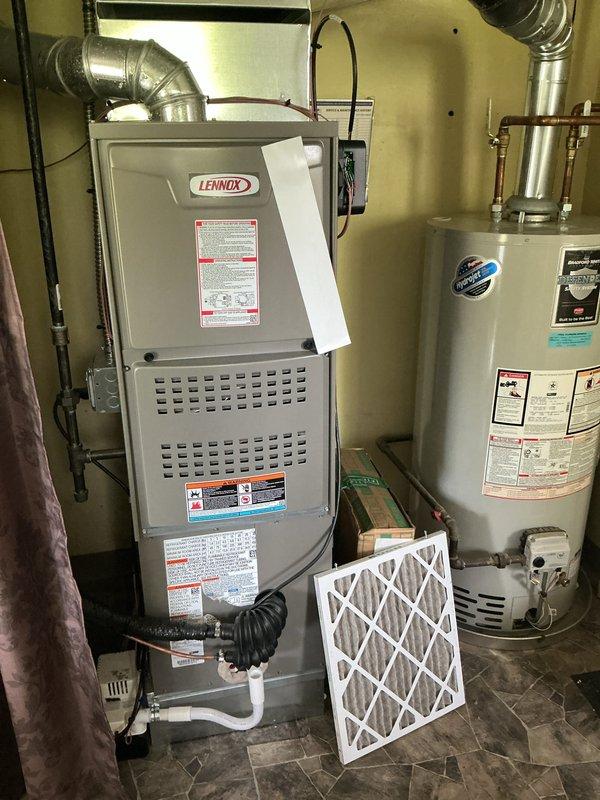 Completed annual HVAC maintenance inspection on residential Lennox furnace and outdoor condenser unit. Replaced air filter, inspected all system components for proper operation, and noted debris accumulation around outdoor unit requiring attention for optimal airflow and efficiency.