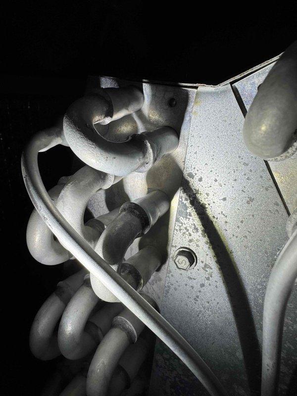 Responded to service call for 3-year-old A/C system struggling to maintain temperature, with unit set to 70°F but indoor temperature reaching 80°F. Upon arrival, found evaporator coil and refrigerant lines severely frozen with substantial ice buildup throughout the system. Documented frozen coil condition with photos showing complete frost coverage on copper tubing, expansion device, and surrounding components. Instructed system shutdown to allow complete ice melt before diagnostics could proceed, as frozen conditions prevent accurate assessment of underlying issues such as potential low refrigerant charge, restricted airflow, or failed blower motor.