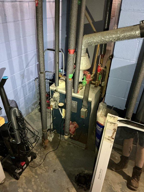 Responded to service call for non-operational basement air purifier unit over twenty years old. Performed comprehensive assessment of IAQ equipment and surrounding mechanical systems including evaluation of unit condition, electrical components, and operational viability. Documented existing installation with photos showing equipment location in basement mechanical room alongside HVAC infrastructure, plumbing connections, and ductwork. After thorough inspection, determined unit age and condition warranted replacement rather than repair. Provided customer with professional assessment findings and disposal recommendations for aged equipment.