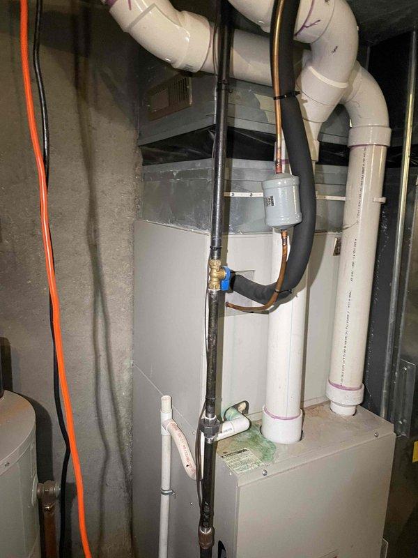Provided estimate for complete HVAC system replacement to address non-functional R-22 air conditioning unit with slow refrigerant leak in basement installation. Assessed existing furnace and air handler configuration, including refrigerant line routing, electrical connections, condensate drainage system, and ventilation requirements for proper equipment upgrade specifications. Documented current equipment layout and mechanical room accessibility to determine replacement unit sizing and installation parameters.