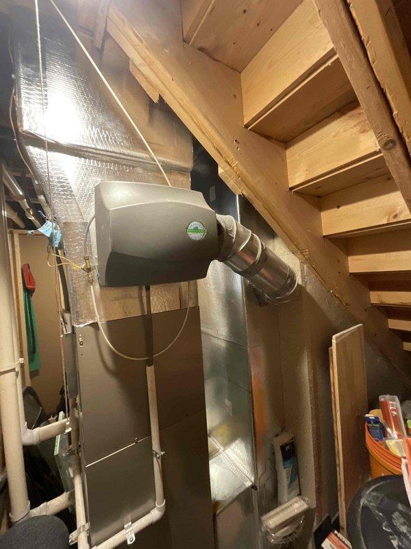 Responded to service call for furnace water leak and frozen AC unit. Upon arrival, assessed HVAC system in basement utility area and provided estimate for complete system replacement. Customer was previously advised to shut down system to allow ice accumulation to melt prior to technician visit.