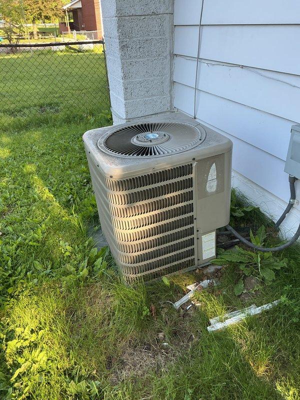 Completed preventive maintenance tune-up on a Goodman residential air conditioning system, model V8X130181FF, utilizing R-410A refrigerant. Performed comprehensive inspection of outdoor condenser unit, verified electrical connections and amperage draws within manufacturer specifications, cleaned condenser coil fins, and confirmed proper operation of all system components. Unit tested successfully with all parameters operating within normal range.
